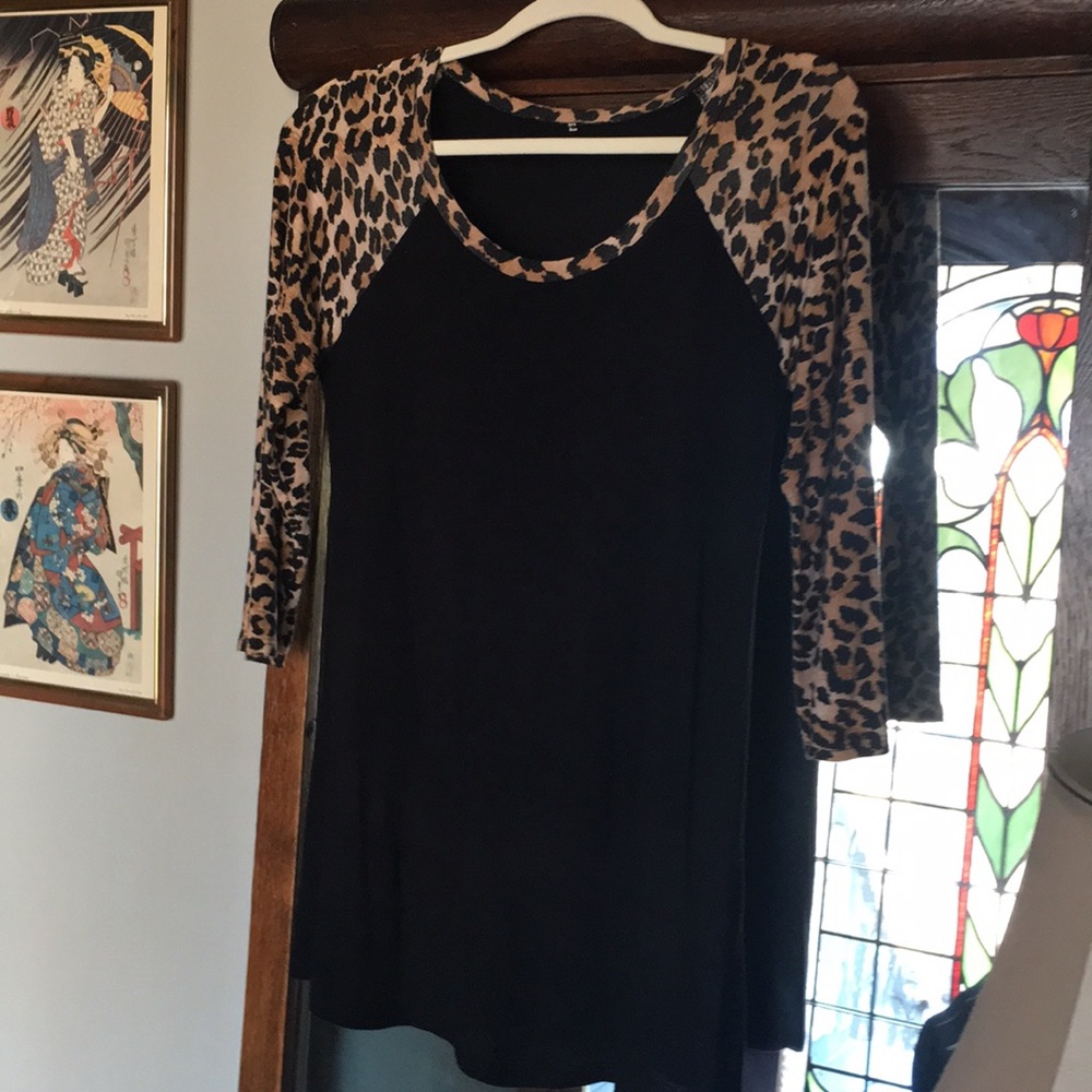 Black top with animal print sleeves